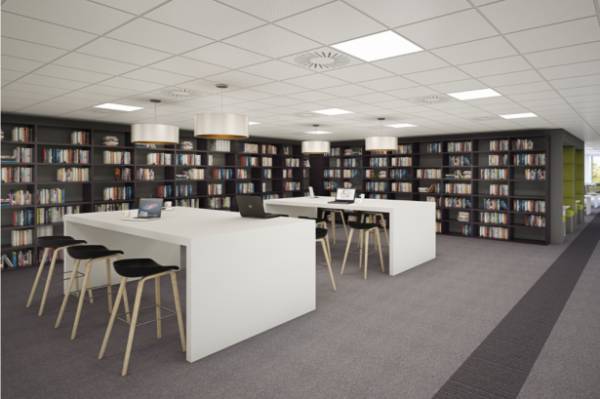 Office Photo with Desks surrounded by Book Shelves with Grey Carpet tiles